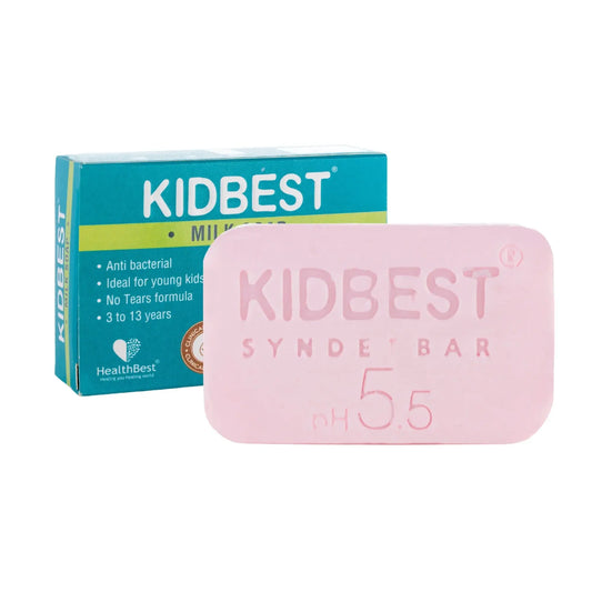 A pink Kidbest Milk Syndet Bar soap in front of its teal and yellow packaging box on a white background.